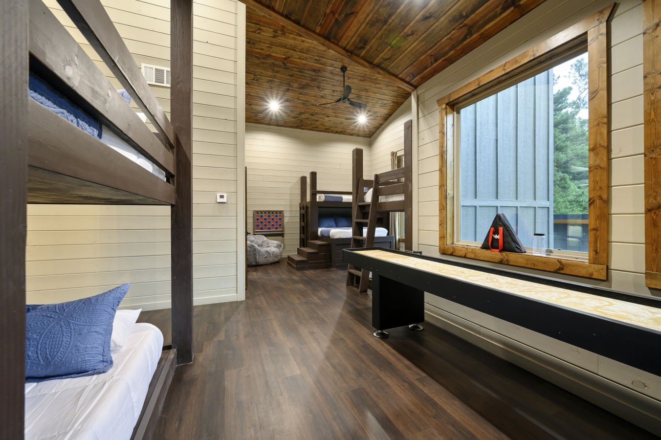Sleep, play shuffleboard, and wake up ready for more — all from one incredible room.