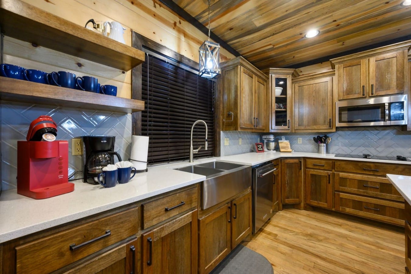 Rich wood cabinetry and dual coffee makers set the stage for a perfect cabin morning.