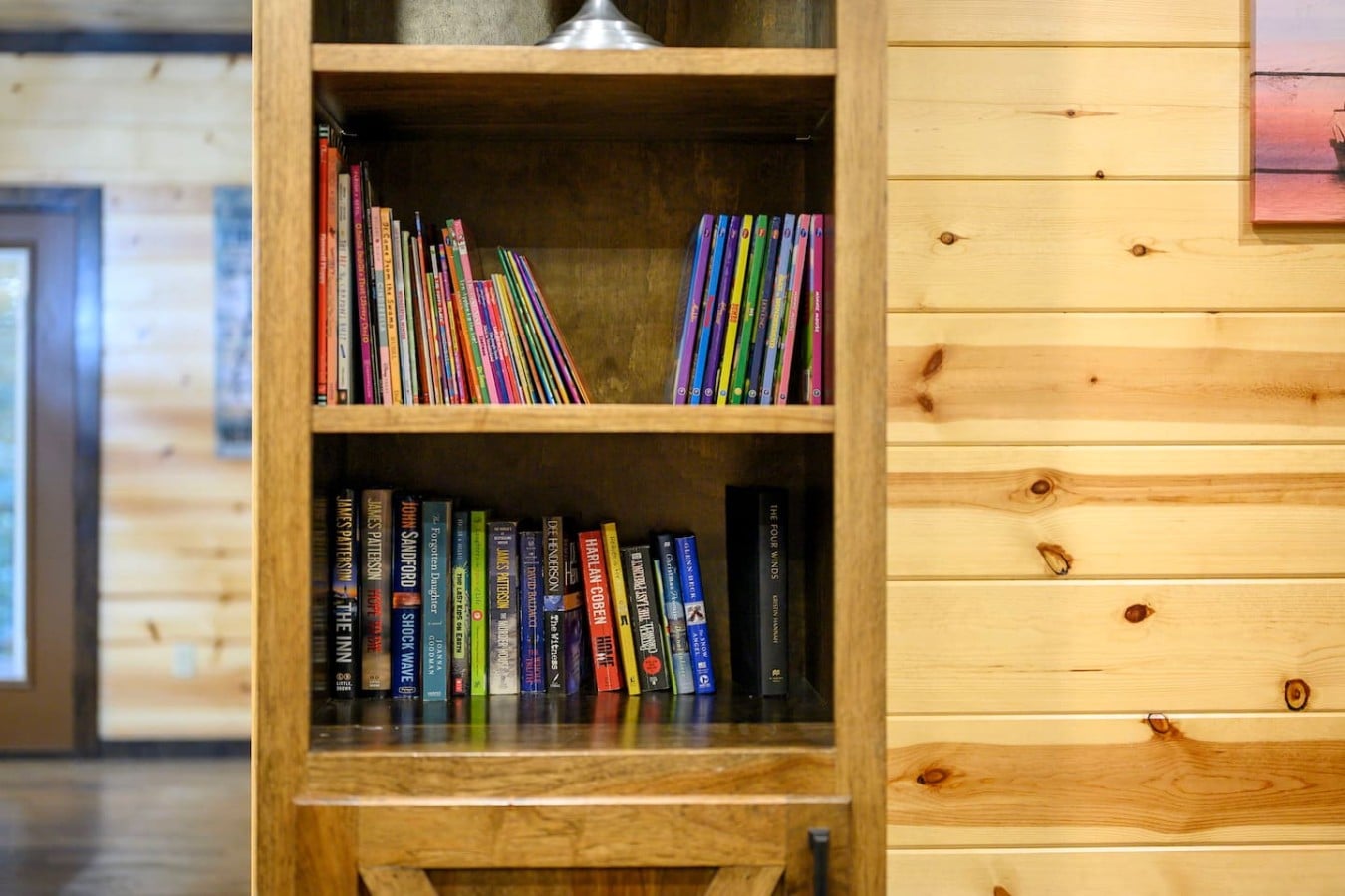 Whether it's bedtime stories or beach reads, the cabin bookshelf has everyone covered.