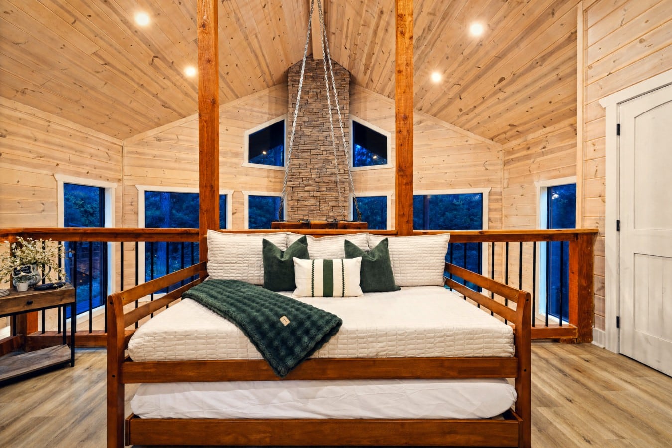 Fall asleep in the treetops from this dreamy loft perch above the great room.