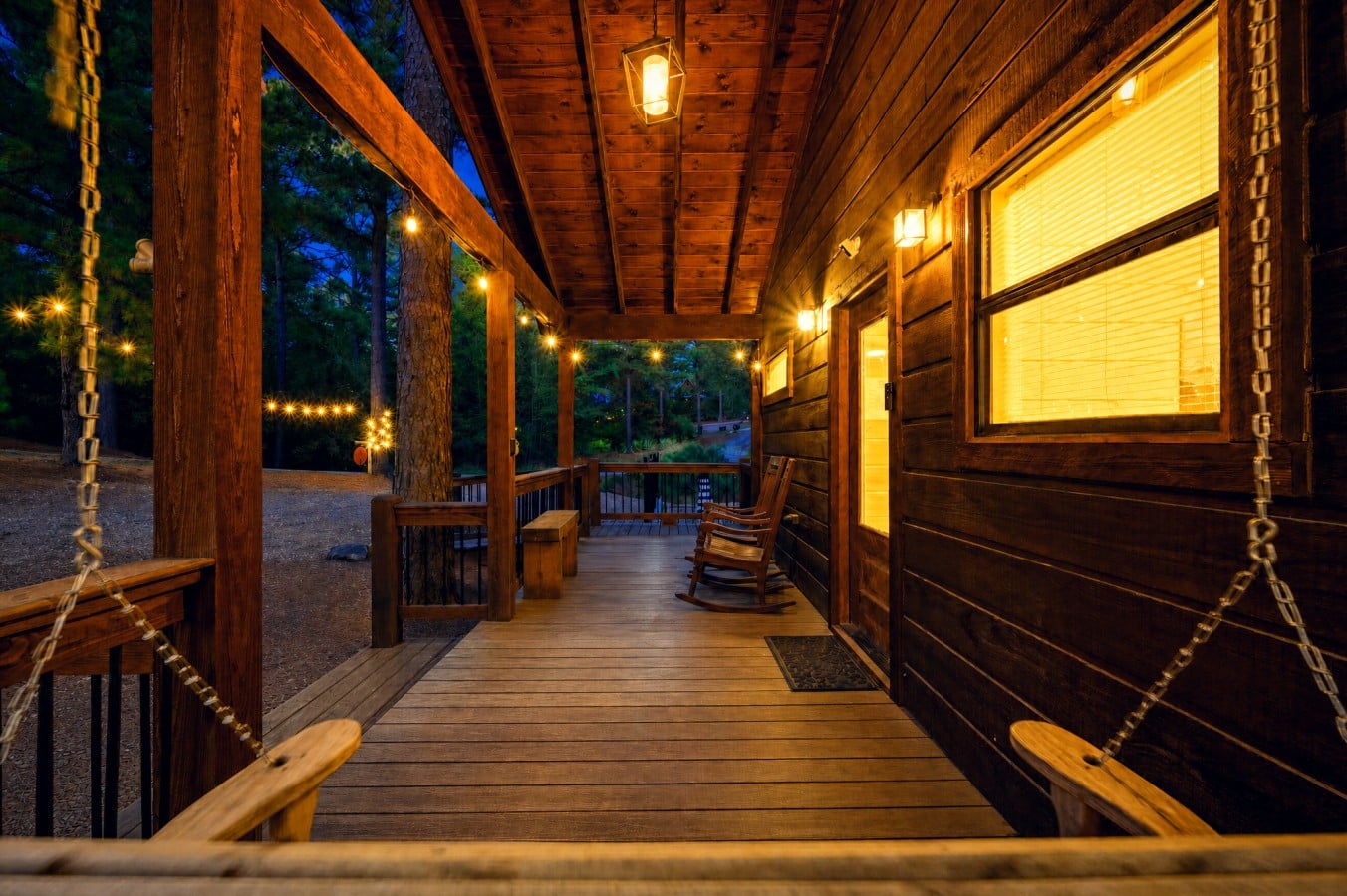 Swing the night away under Edison lights while the forest hums around you.
