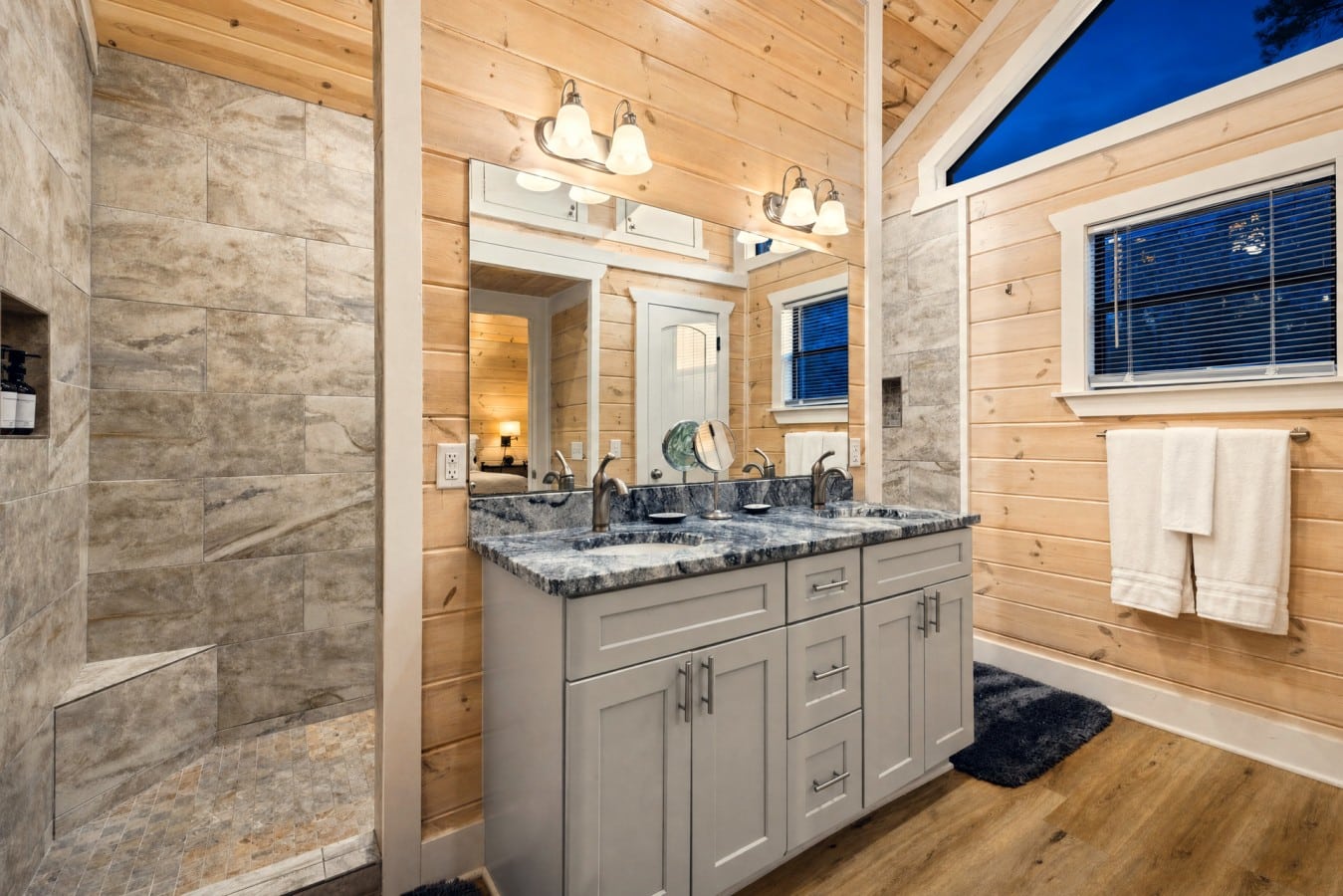Refresh in a spa-worthy walk-in shower wrapped in warm wood-plank walls.