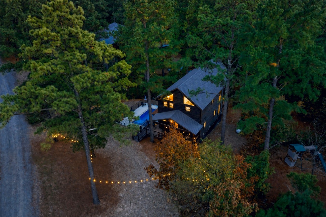 Tucked deep in the pines, your glowing cabin hideout awaits from every angle.