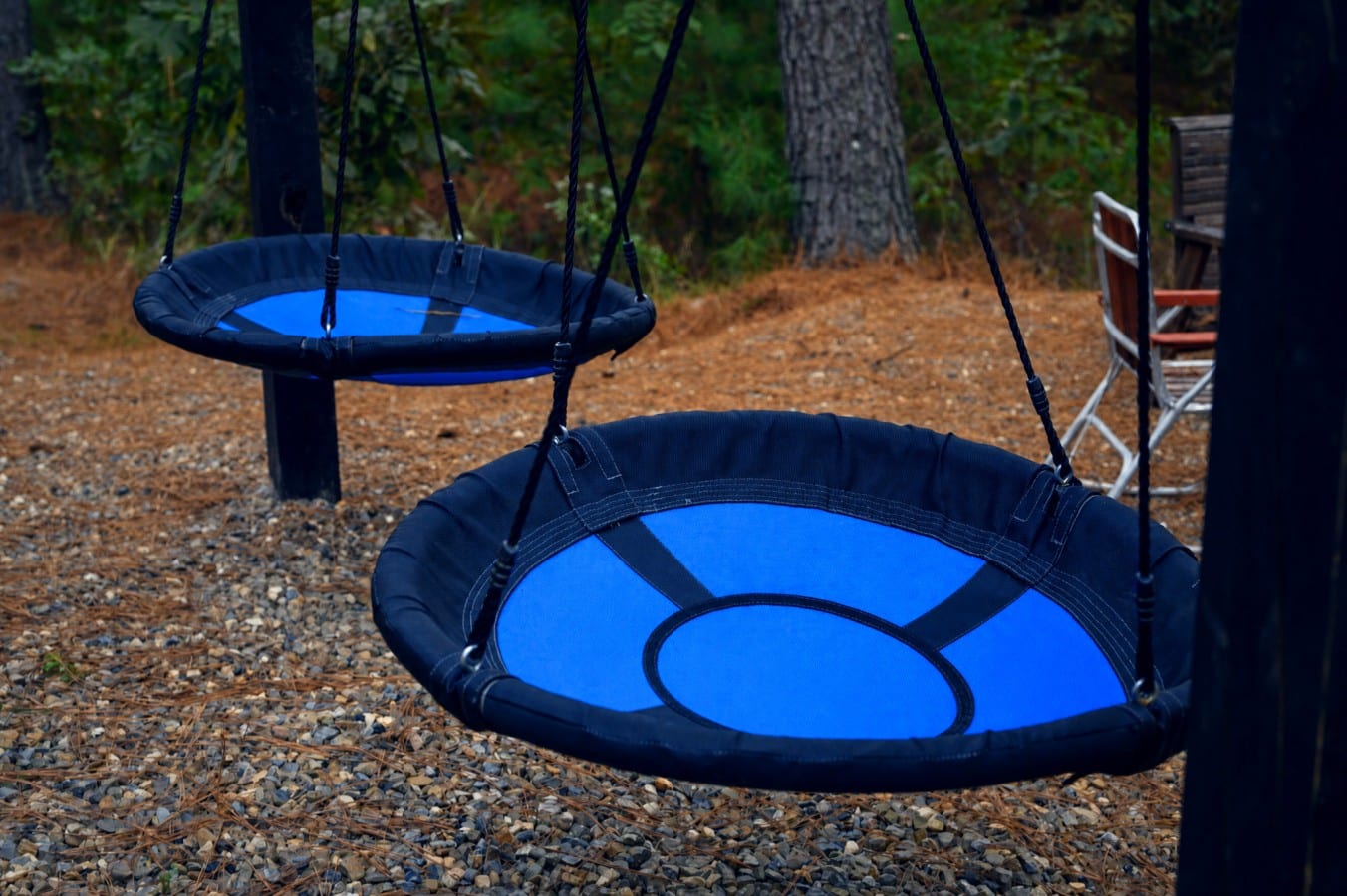 Kids will beg for just one more spin on the giant nest swings in the pines.