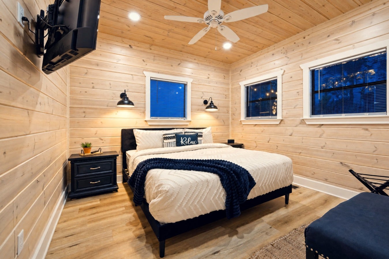 End your mountain day with Netflix from bed in this king retreat glowing with warm sconce light.