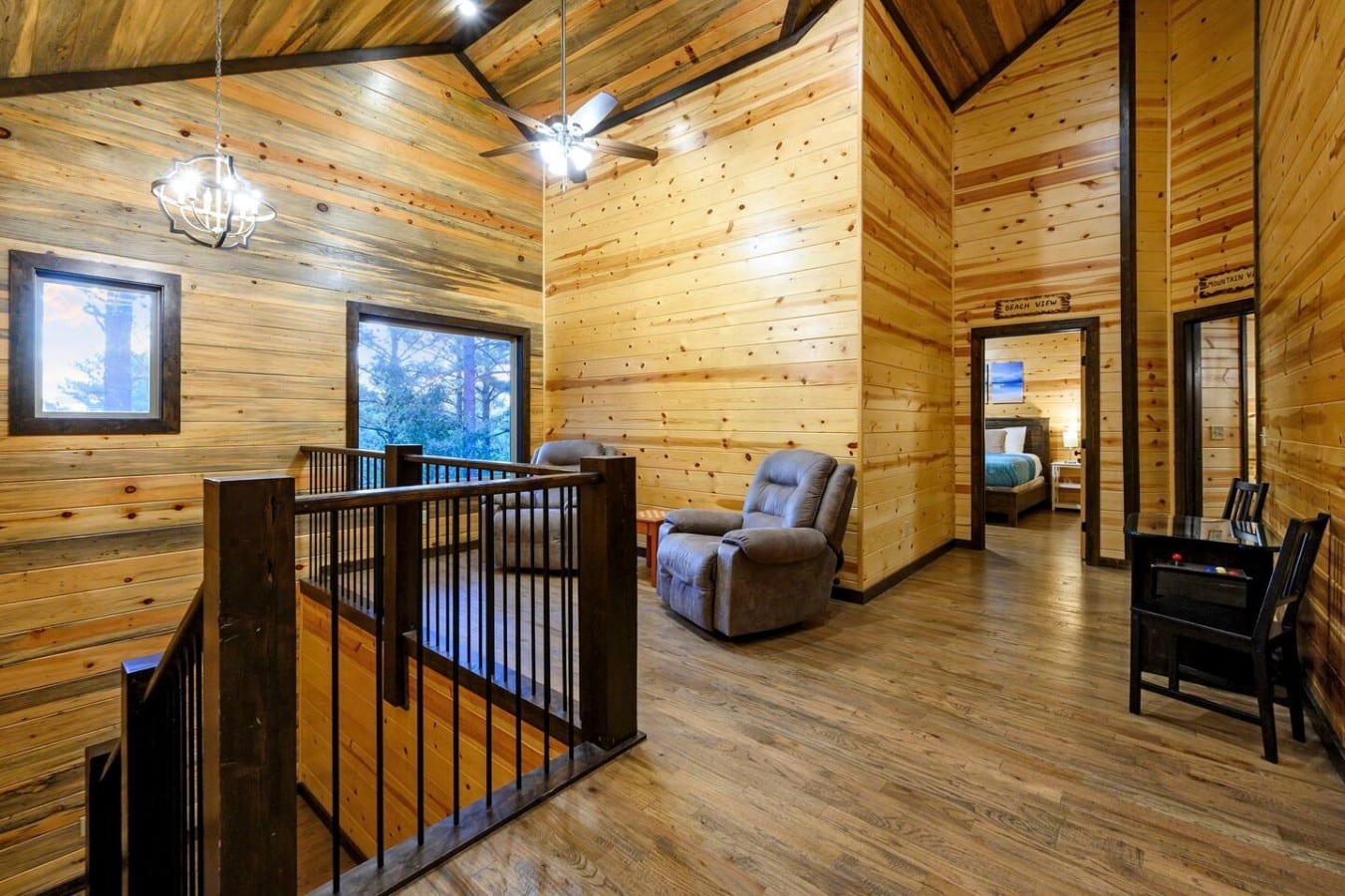 Game tables, recliners, and themed bedrooms make the loft a destination of its own.