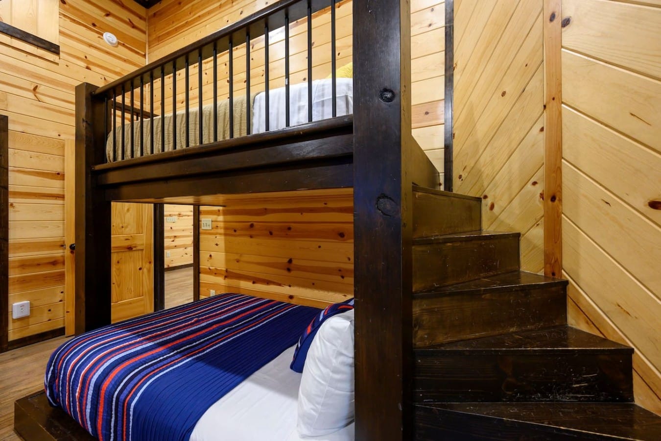 Full-over-full bunks with staircase access make this room a hit with the whole crew.