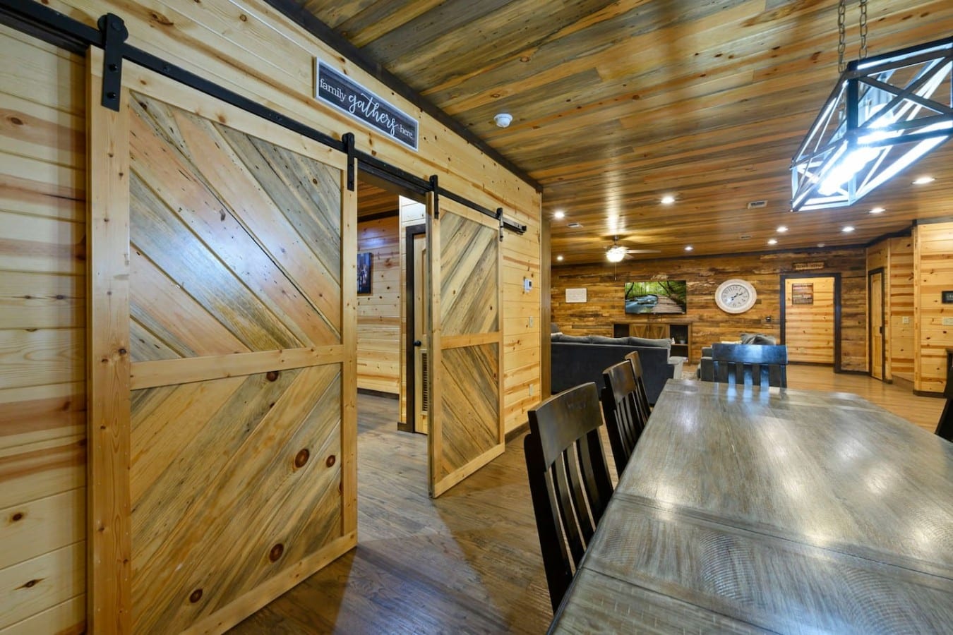 Dramatic barn doors frame the dining space where your best vacation meals happen.