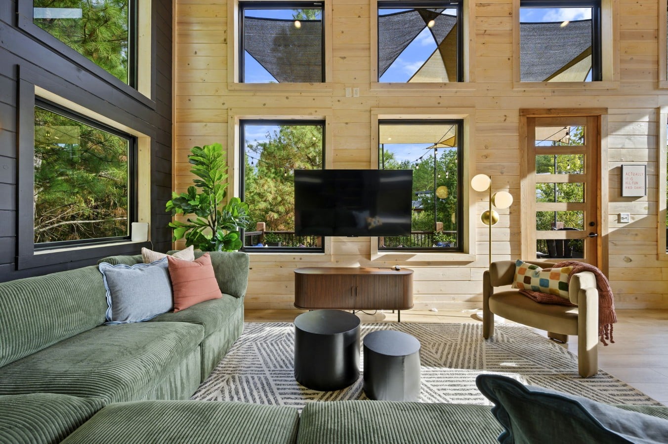 Sink into the sectional while forest views stretch endlessly beyond the deck doors.