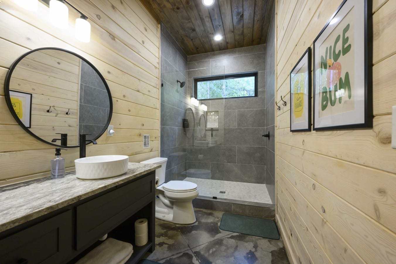 Freshen up in a charming shiplap bath that keeps things cozy and lighthearted.