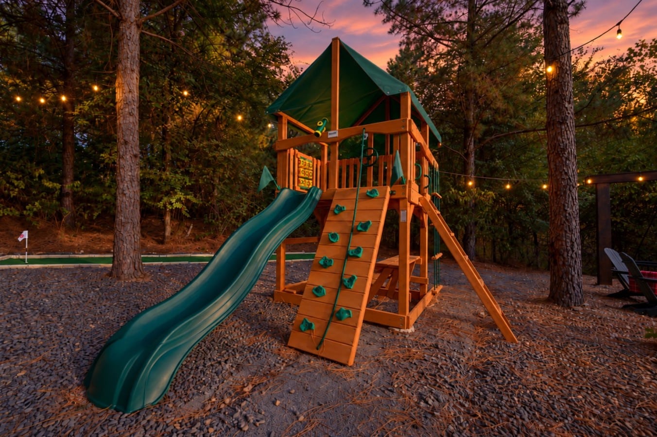 A private playset with a slide and climbing wall keeps the little ones busy for hours.