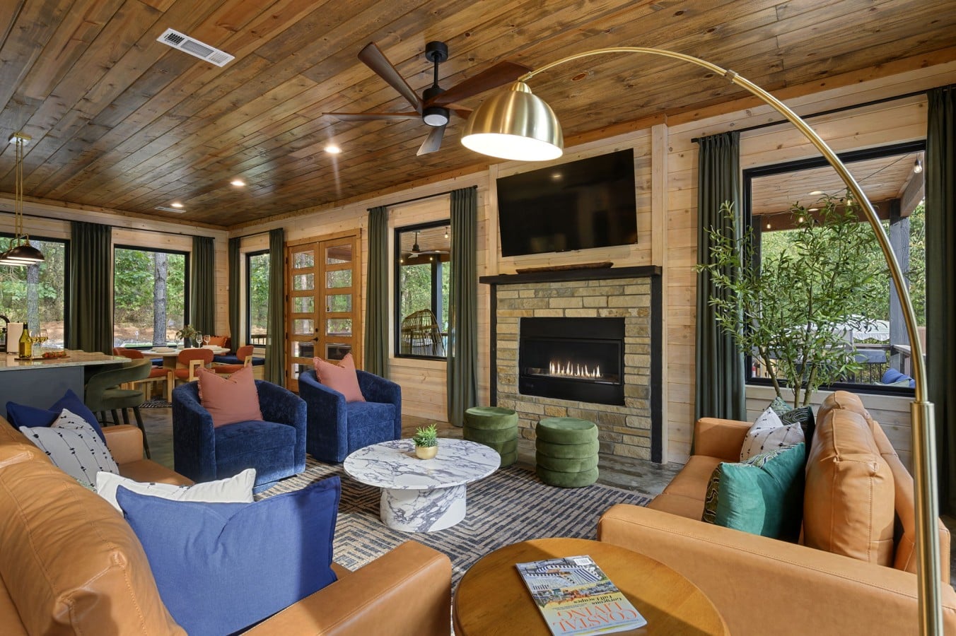 Velvet chairs, cognac leather sofas, and a crackling stone fireplace make staying in irresistible.