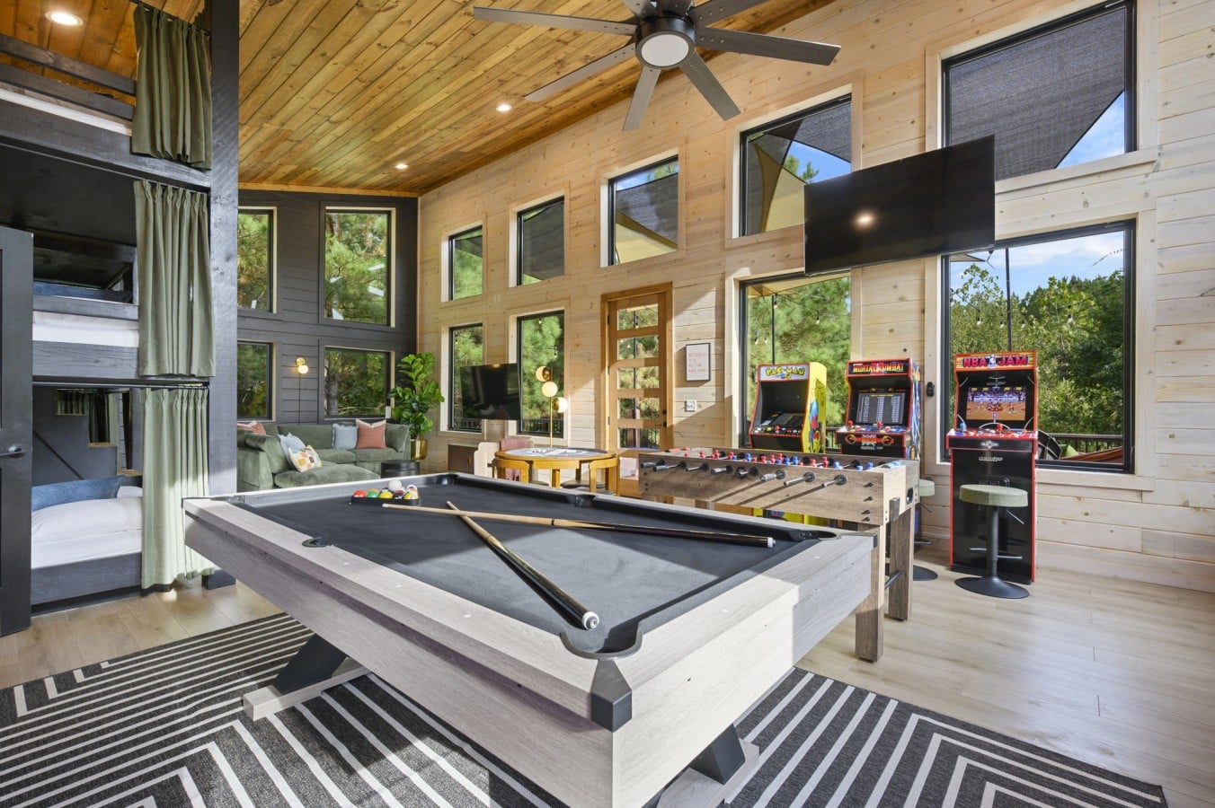Pool table, bunk beds, arcade, and vaulted ceilings — the game room has it all.