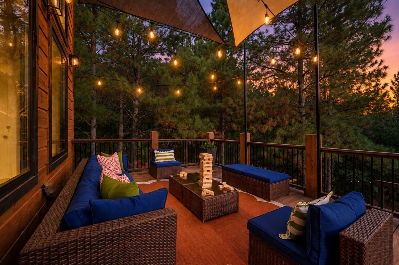 Wicker seating, string lights, and treetop views make the upper deck the best seat in the house.