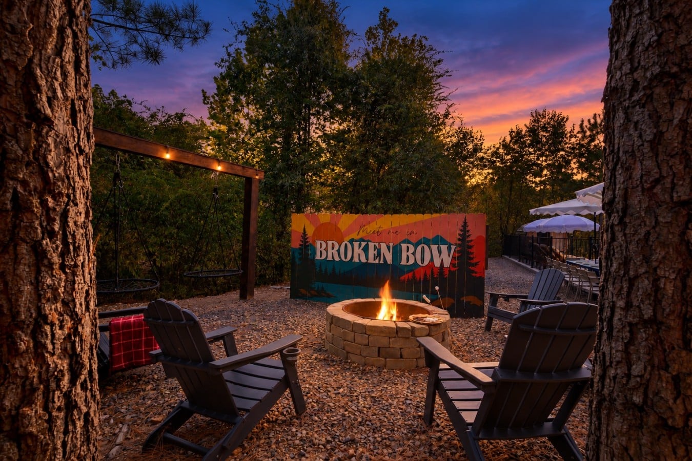 String lights, Adirondack chairs, and a crackling fire pit make every night magical.