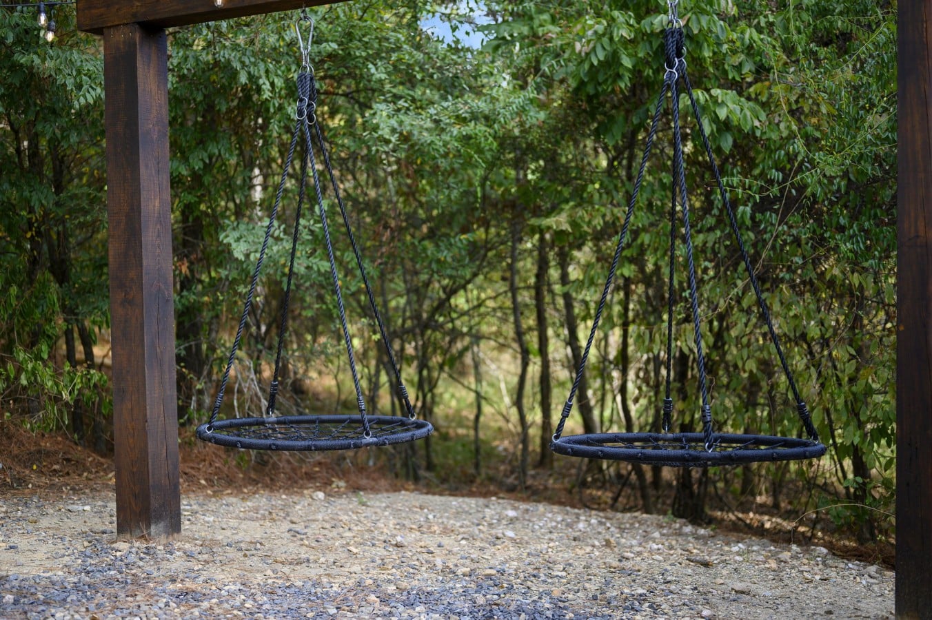 Swing through the trees — the kids (and adults) will claim these nest swings immediately.