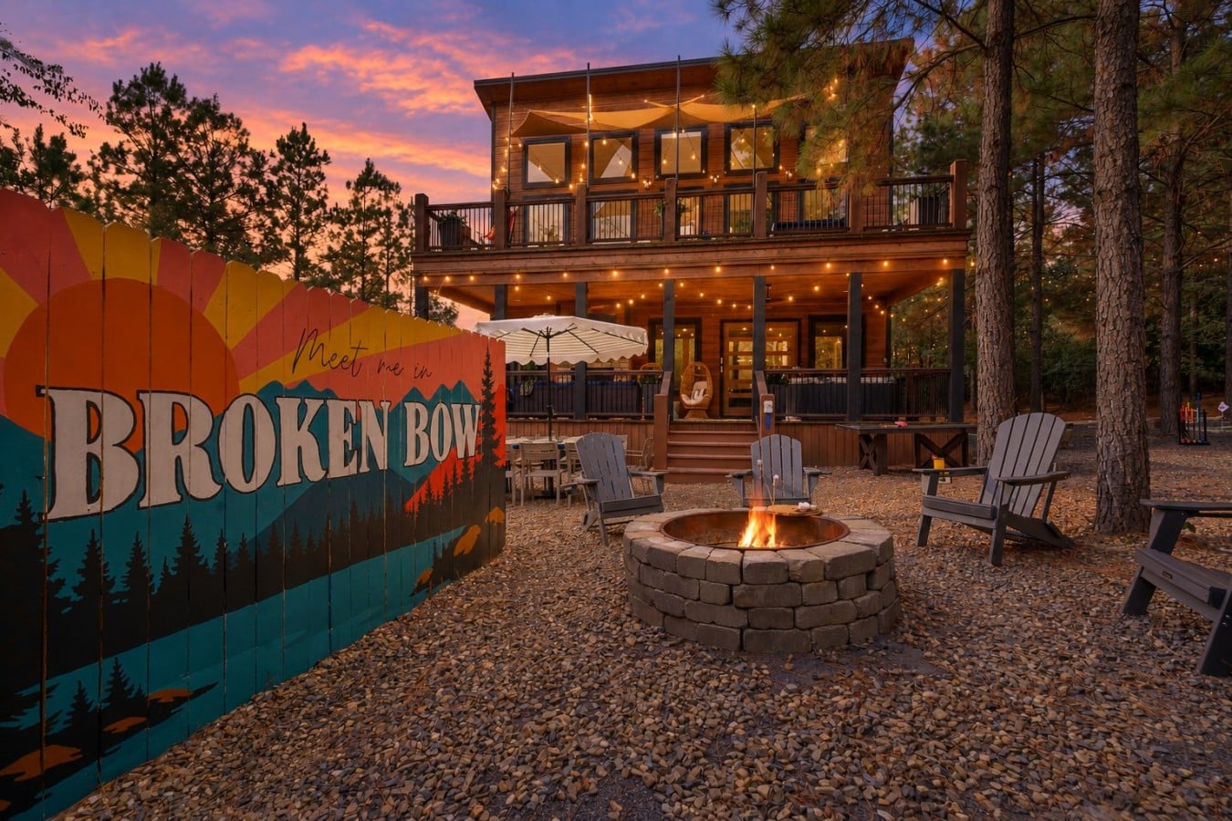 Fire pit, mural, and a pink sky overhead — evenings here are nothing short of magical.