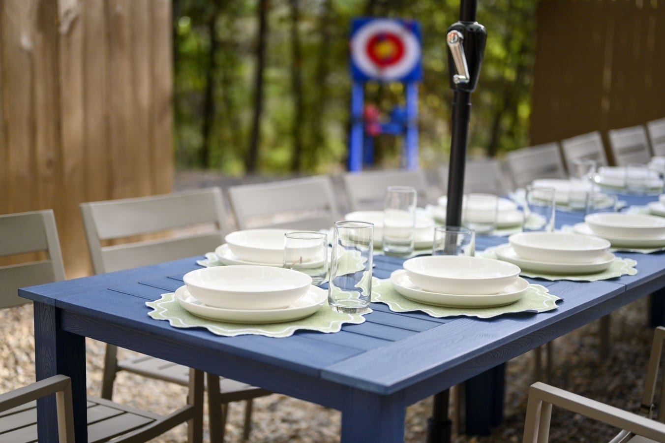 Grab an archery break between courses at a beautifully set outdoor table with room for everyone.
