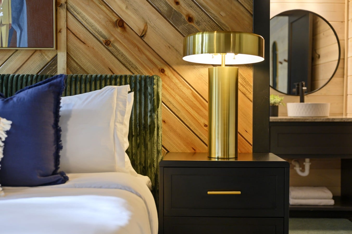 Warm lamp glow and cedar walls make winding down at night effortlessly inviting.