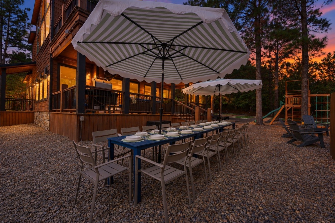Seat the whole crew for an al fresco feast under glowing umbrellas as the lodge lights up behind