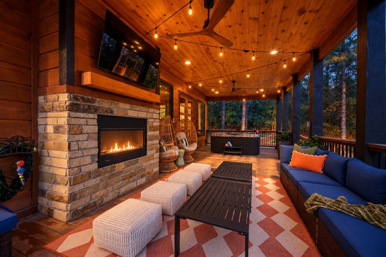 Movie nights, hot tub soaks, and a roaring outdoor fireplace — all from one stunning deck.