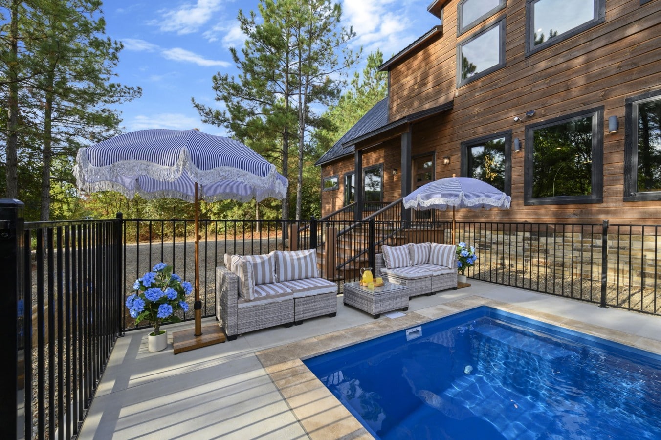 Tuck into shaded wicker seating right at the pool's edge for the ultimate afternoon hideaway.