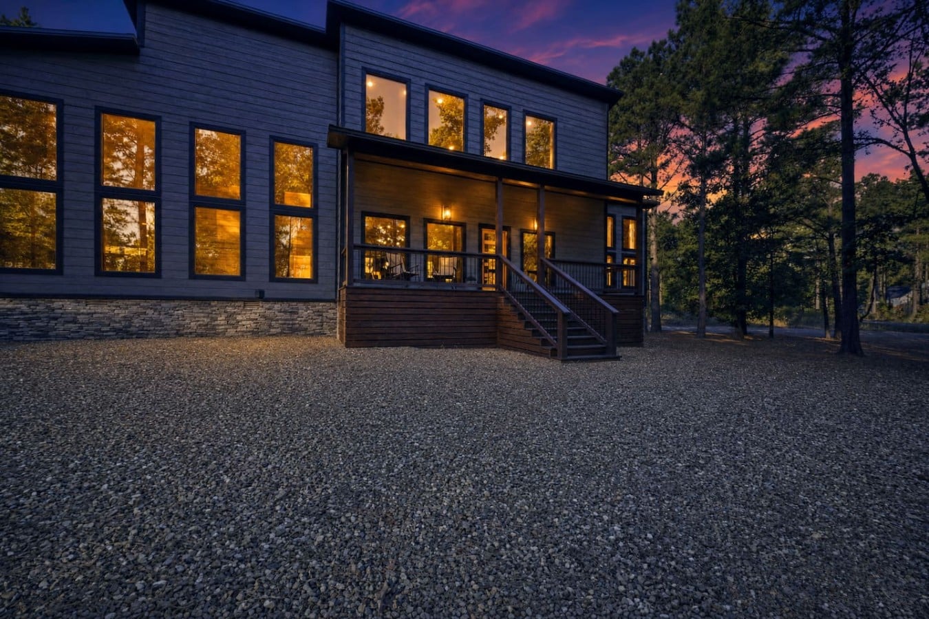 Stone, wood, and a vivid purple sky — this cabin makes a stunning first impression.