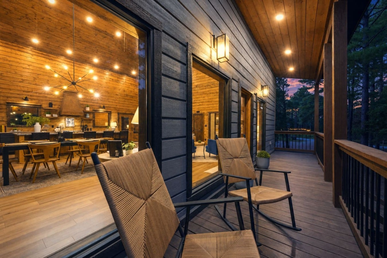 Rock on the deck and watch life unfold through the glowing cabin windows.