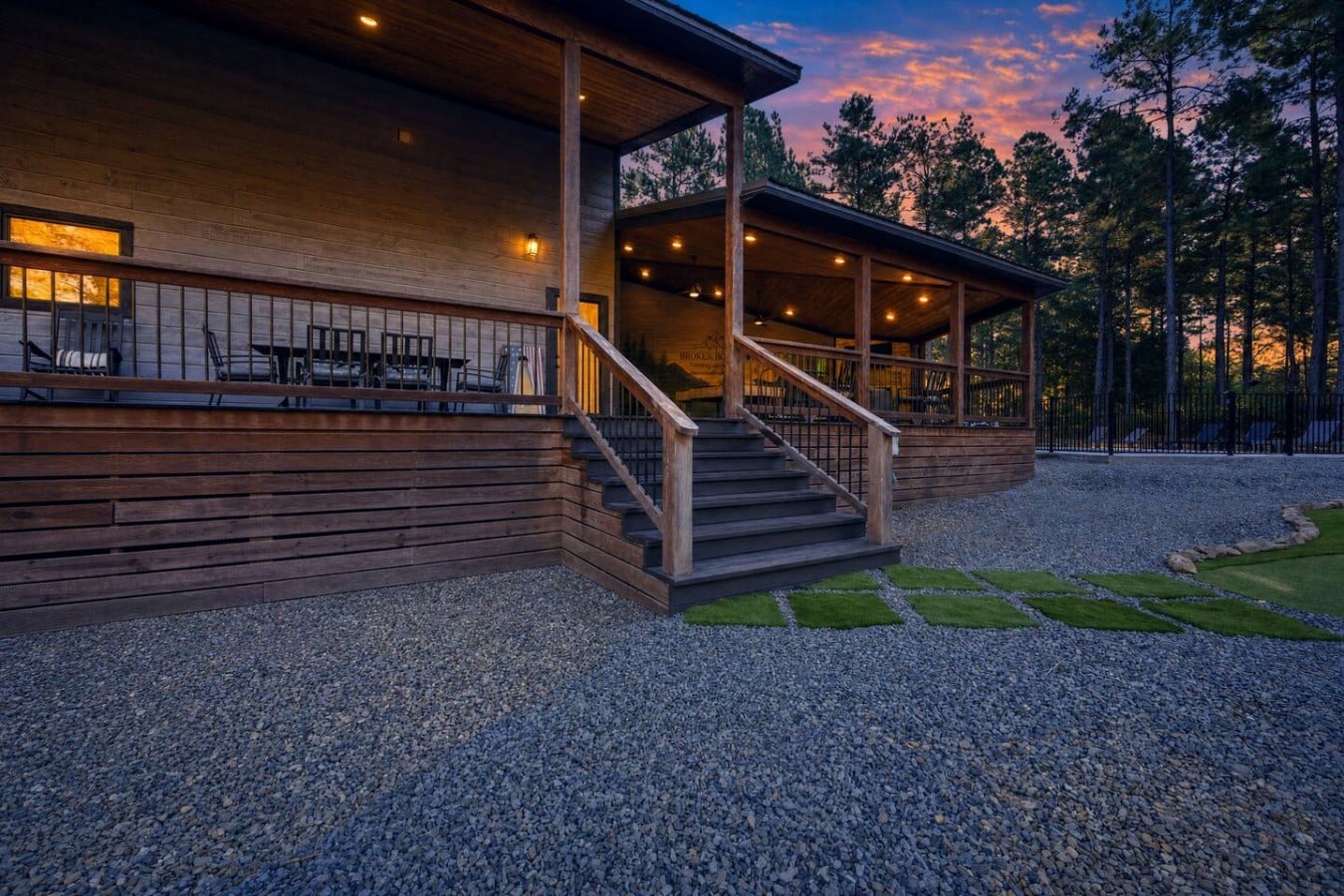 Stroll the stone path from a glowing deck straight to your private pool escape.