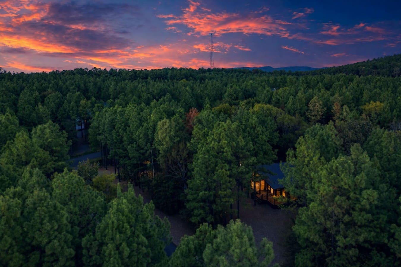 Sunsets from this forest hideaway paint the sky in colors you'll never want to leave.