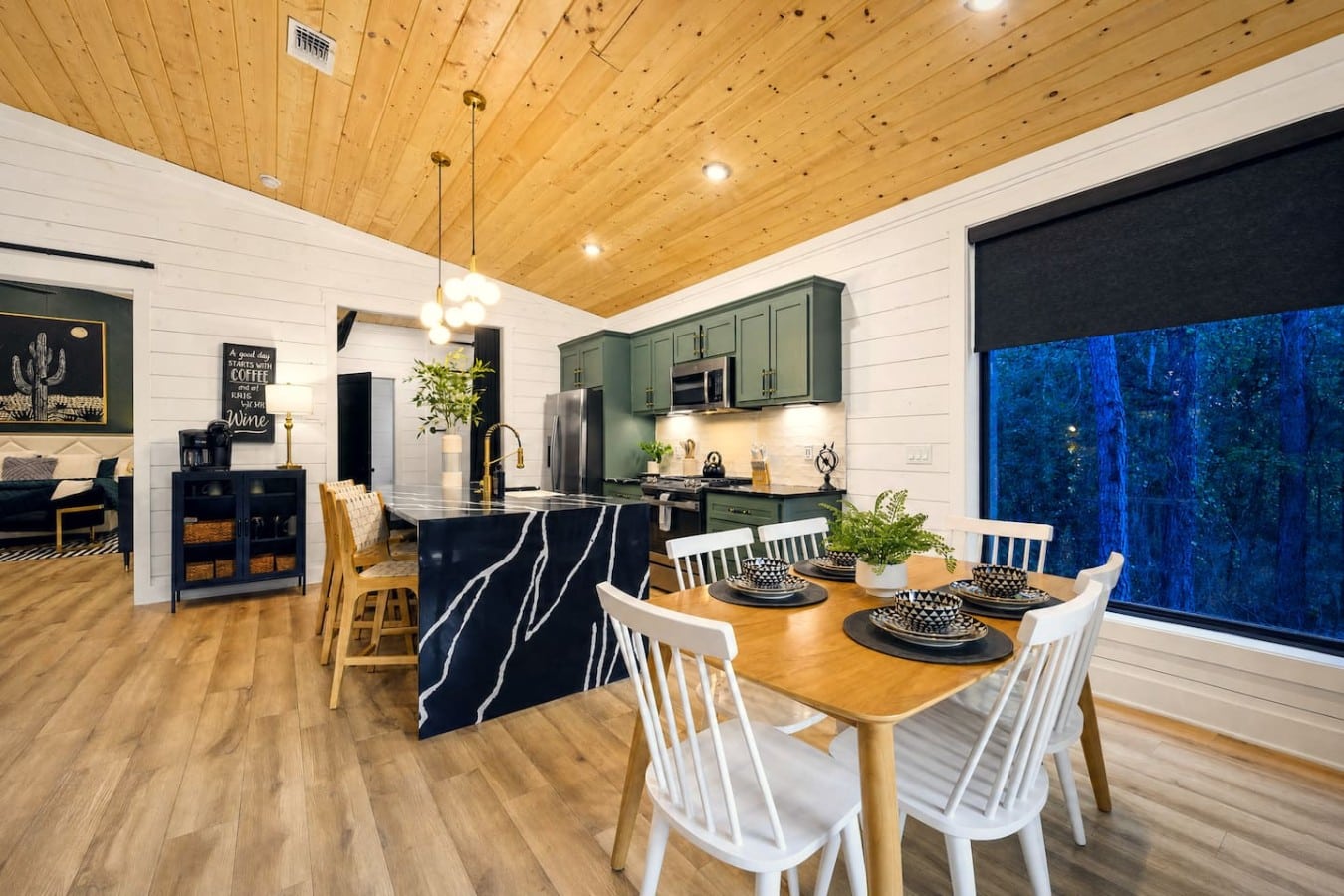 Cook together, then sit down for dinner with a front-row view of the forest beyond.