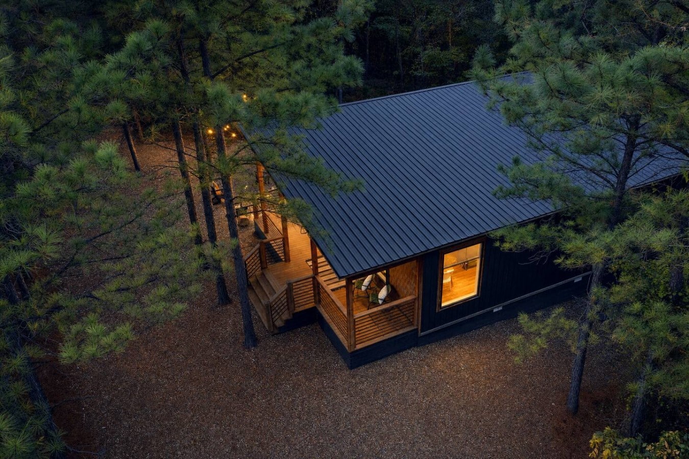 Seen from above, this glowing forest retreat proves some escapes are truly one of a kind.