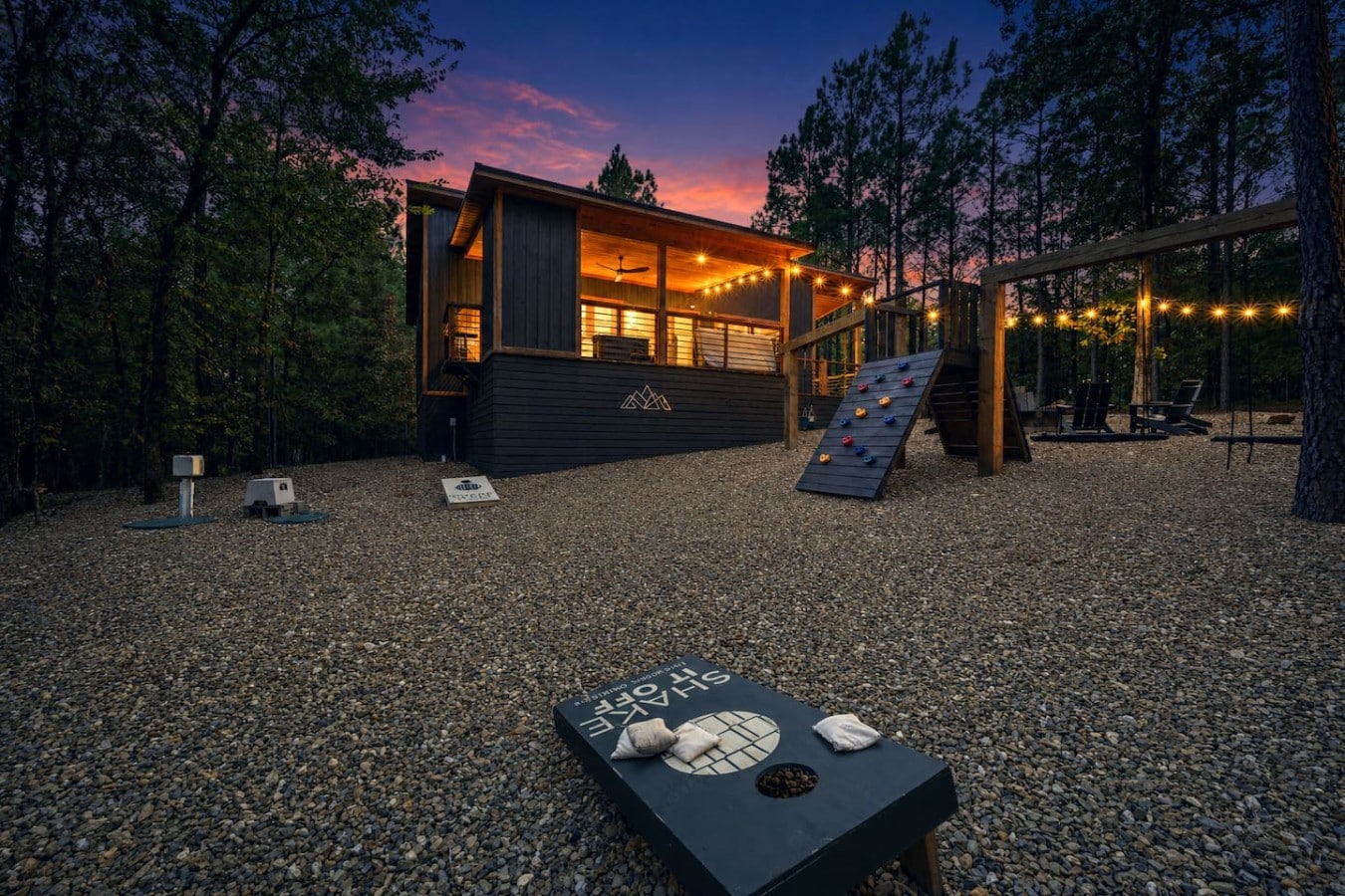 Cornhole, climbing walls, fire, and stars—this backyard was made for unforgettable nights.