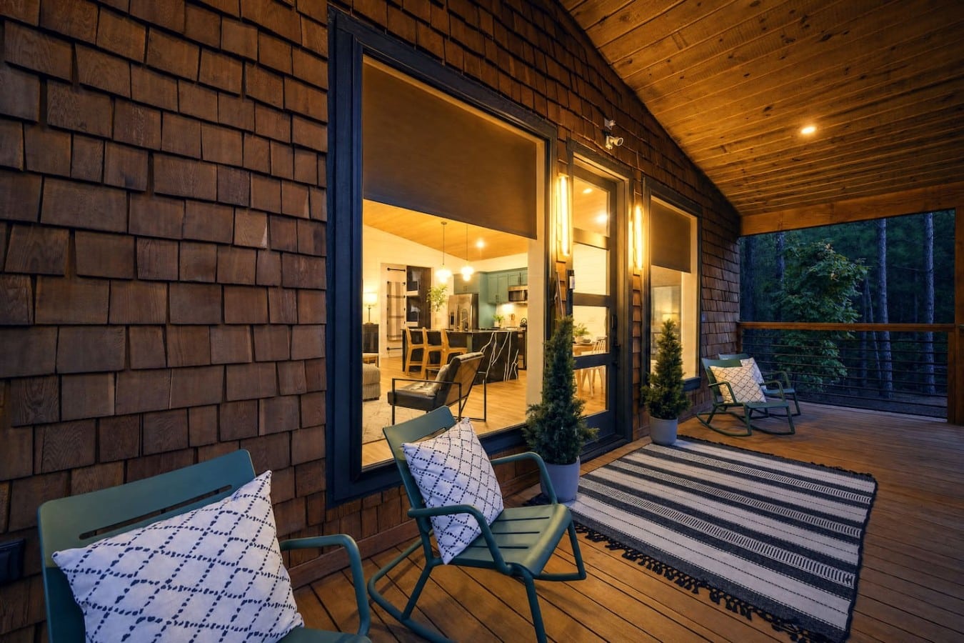 Rock on the covered porch with a warm drink as the forest settles into evening quiet.